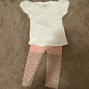 White top with lace leggings.
